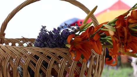 lavenders and red stargazer lily on the wicker basket