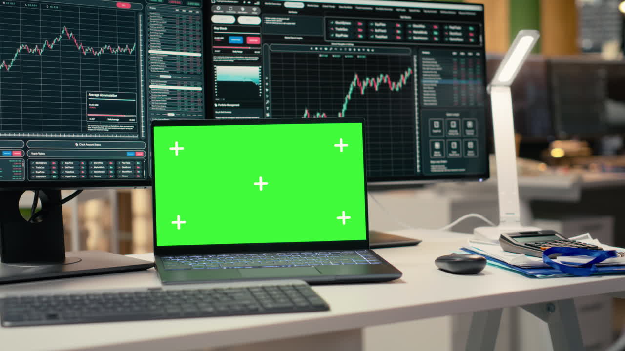 Close up of green screen laptop and trading app in asset management company