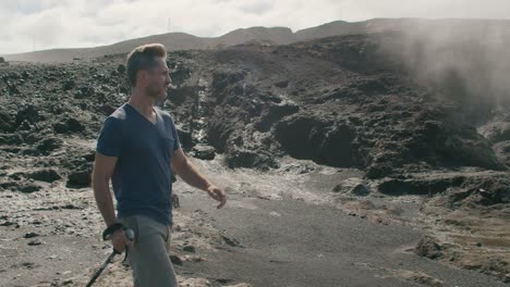 male traveler walking near blowhole