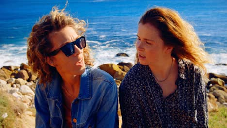 female friends interacting with each in the beach 4k