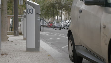 electric car at power supply station in the city