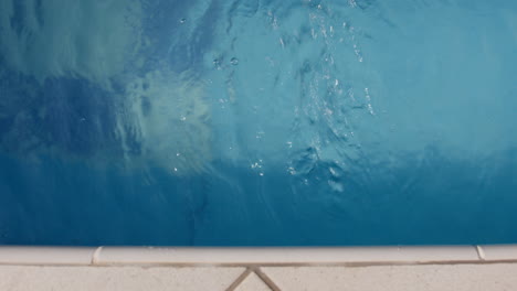 blue swimming pool water with bubbles