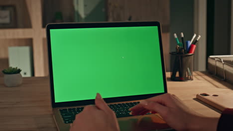 student watching course mockup laptop in evening apartment closeup. woman online