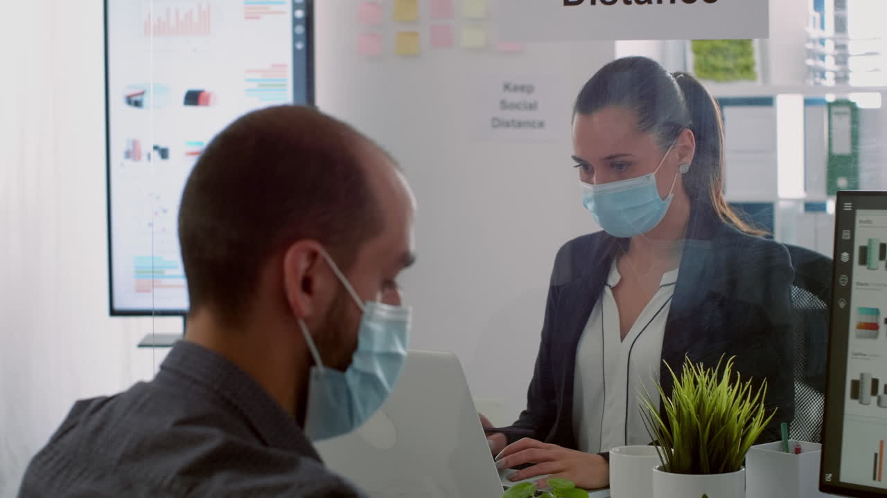 Coworkers working at business ideas wearing protection face mask