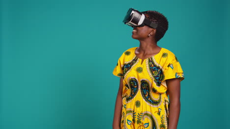 Young-happy-woman-working-with-a-virtual-reality-headset-in-studio