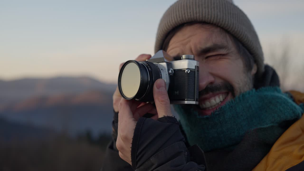 Man with Camera in the Mountains