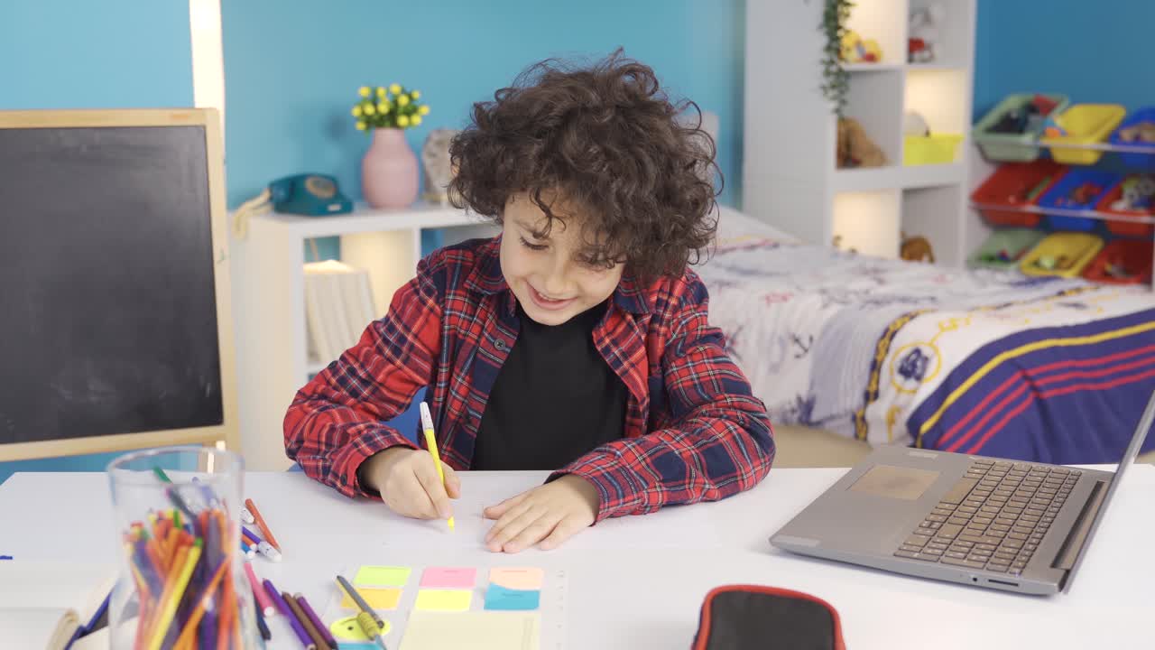 Boy drawing picture. Creative and intelligent boy.
