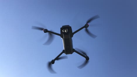 drone fly away from a small tropical beach paradise with palm tree and clear blue sky in nusa penida indonesia