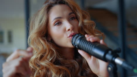 woman singing in microphone. musician snapping fingers in rhythm of the music