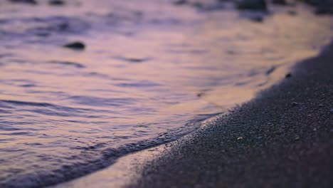 calm ocean waves after sundown