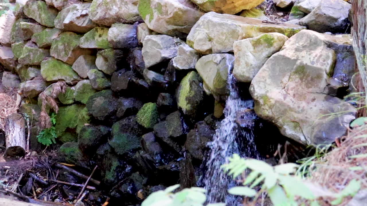 Light waterfall at the end of a stream in the mountains of Northern California