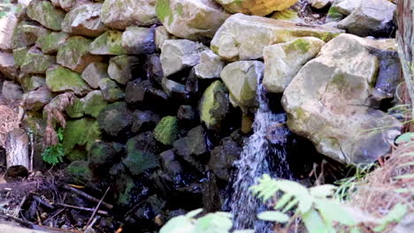 light waterfall at the end of a stream in the mountains of northern california