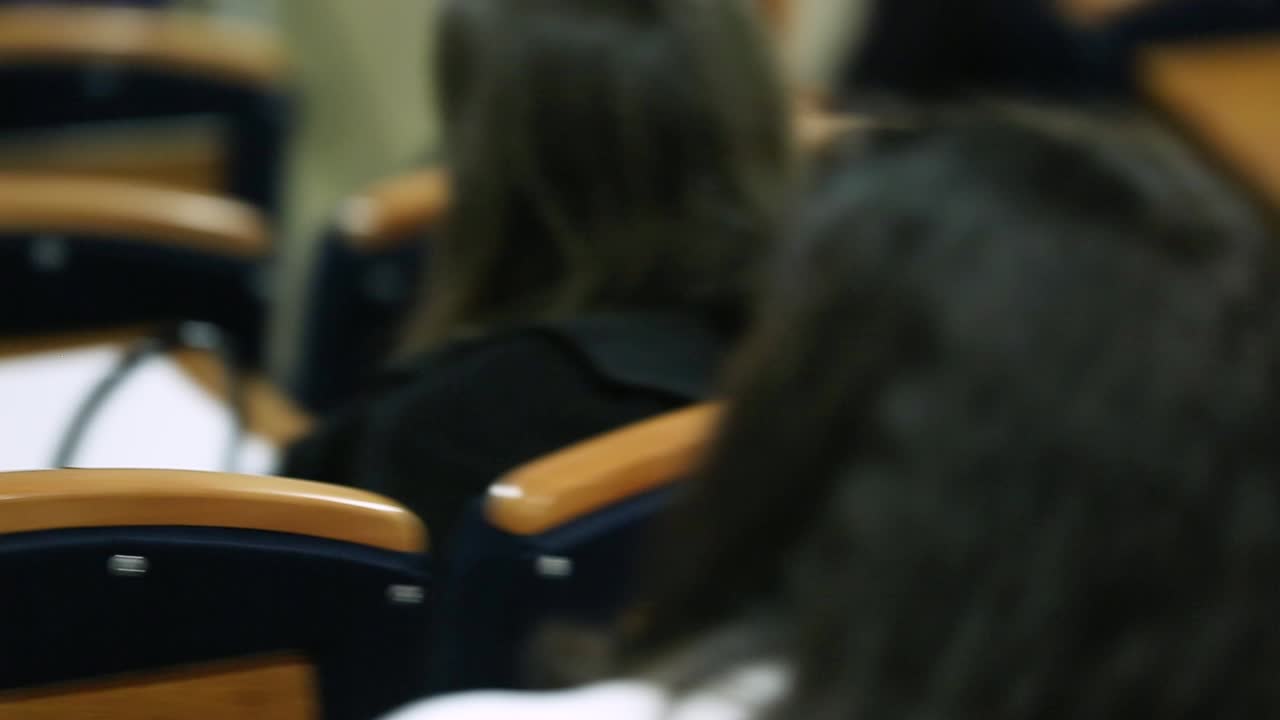 Group of People Listening on The Conference. People listen in business seminar presentation hall of hotel room