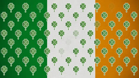 digital animation of multiple clover leaves floating against irish flag