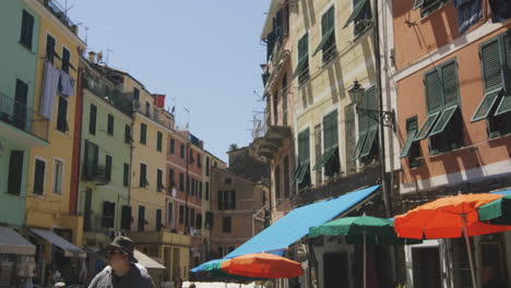 people on the streets with restaurants in the old town of monterosso al mare, cinque terre, italy. slow motion shot