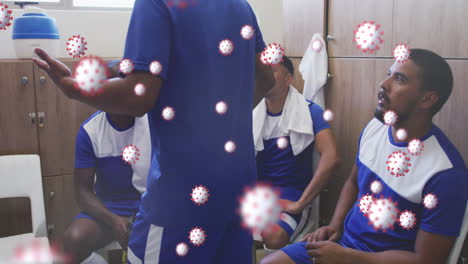 animación de células de virus flotando sobre un grupo diverso de jugadores de fútbol masculino en el vestuario