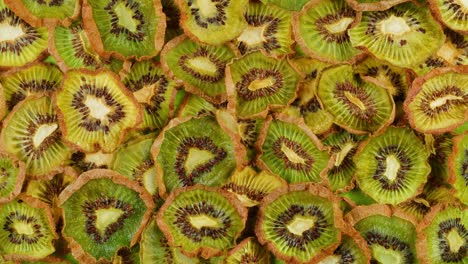 kiwi slices close up background of green, fresh fruit texture.