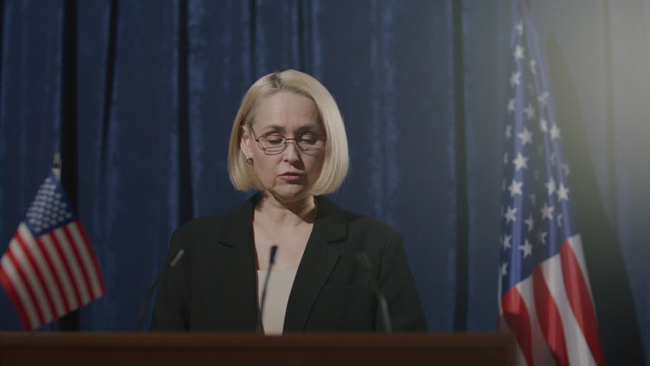 Female Politician Making Government Announcement at Press Event