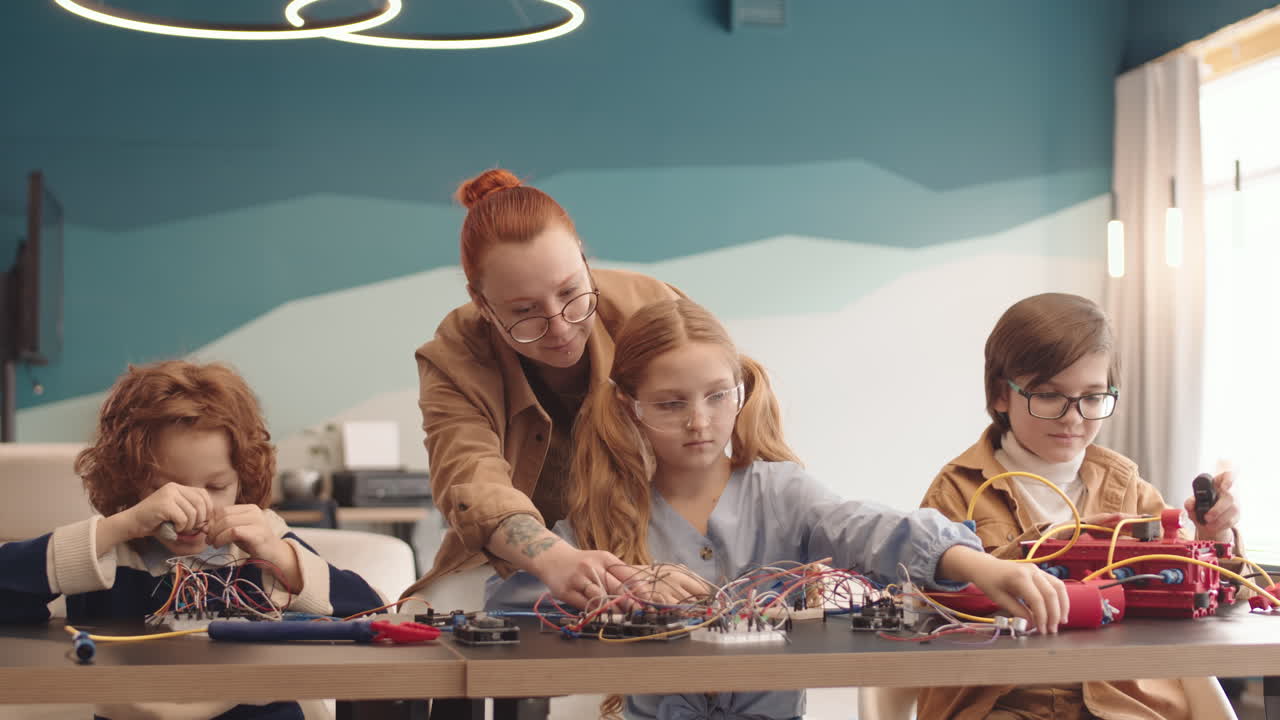 Kids Learning Robotics and Electronics with an Instructor