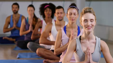 Group-of-people-performing-yoga