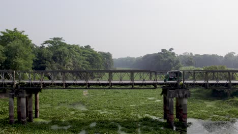 Three-Wheeler-Vehicle-crossing-an-Old-Bridge-in-Rural-Area