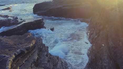 stratified limestone formations along the shores of the bridges of ross at sunrise