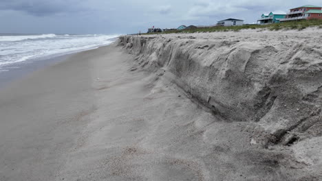 beach shelving after a tropical storm, coastal erosion of sand