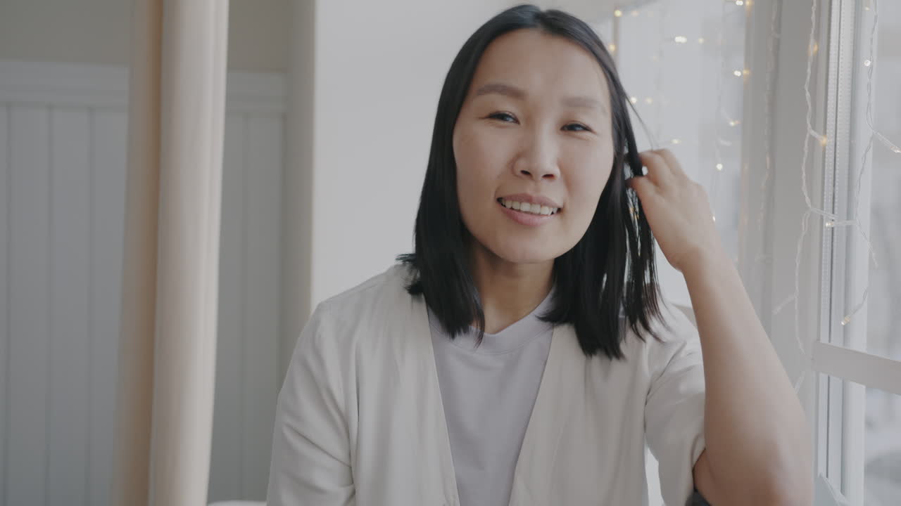 Woman smiling by the window