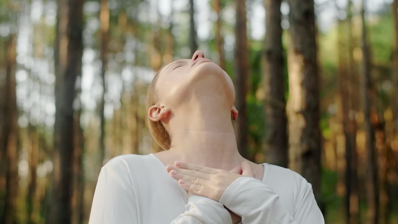 A woman finds peace in the forest