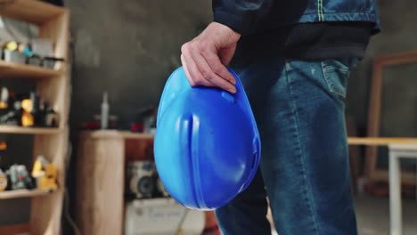 construction worker with safety helmet in workshop