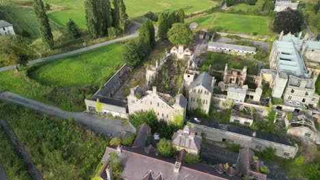 haunted denbigh lunatic asylum, north wales, aerial flyover southwest to northeast perimeter, sunny afternoon