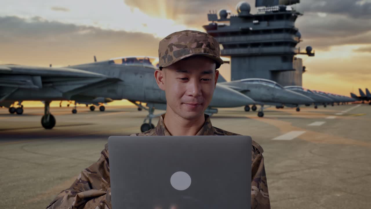 Military Personnel Working on Laptop on Aircraft Carrier Deck