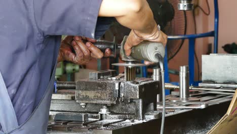 closeup man grinding steel