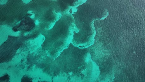 top down shot over crystal clear mediterranean sea revealing alcanada golf course and mountains