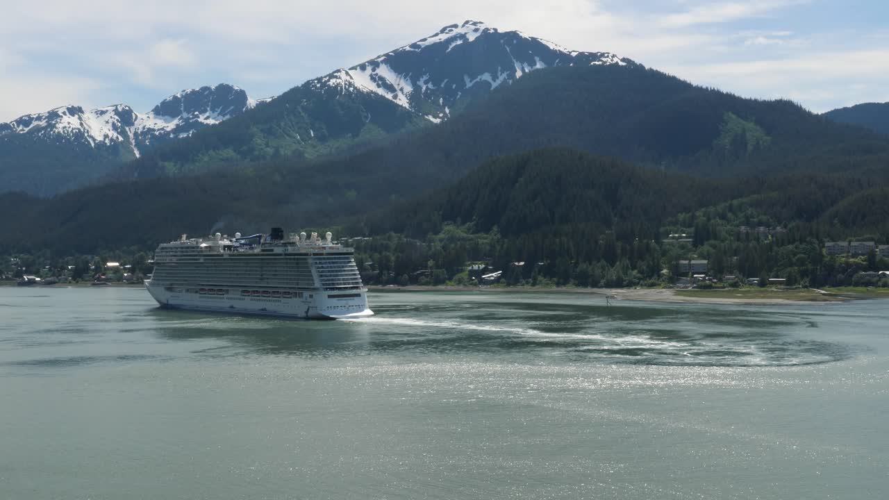 Cruise liner sailing out from Juneau, Alaska. Douglas island with Mount Bradley in the background.