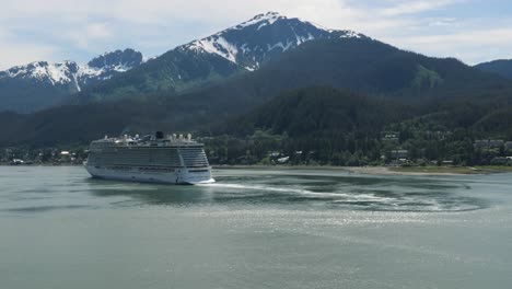 cruise liner sailing out from juneau, alaska. douglas island with mount bradley in the background.