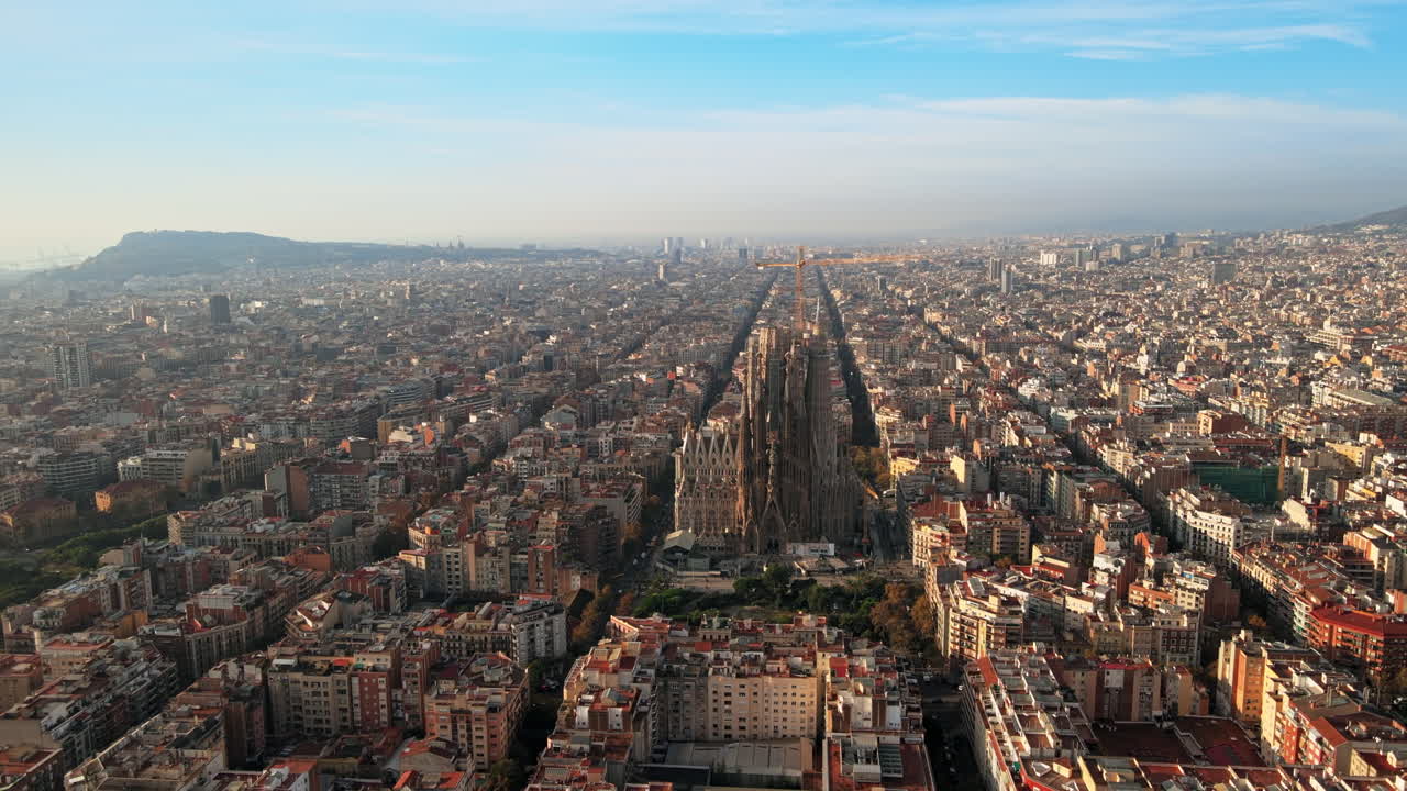 Aerial drone view of Barcelona, Spain. Blocks with multiple residential buildings and Sagrada Familia
