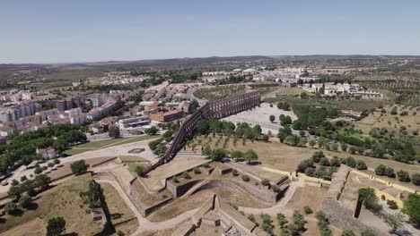 impressive amoreira aqueduct in center, with portuguese city in background