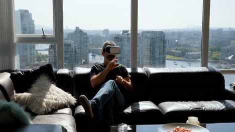 man using virtual reality headset on sofa 4k