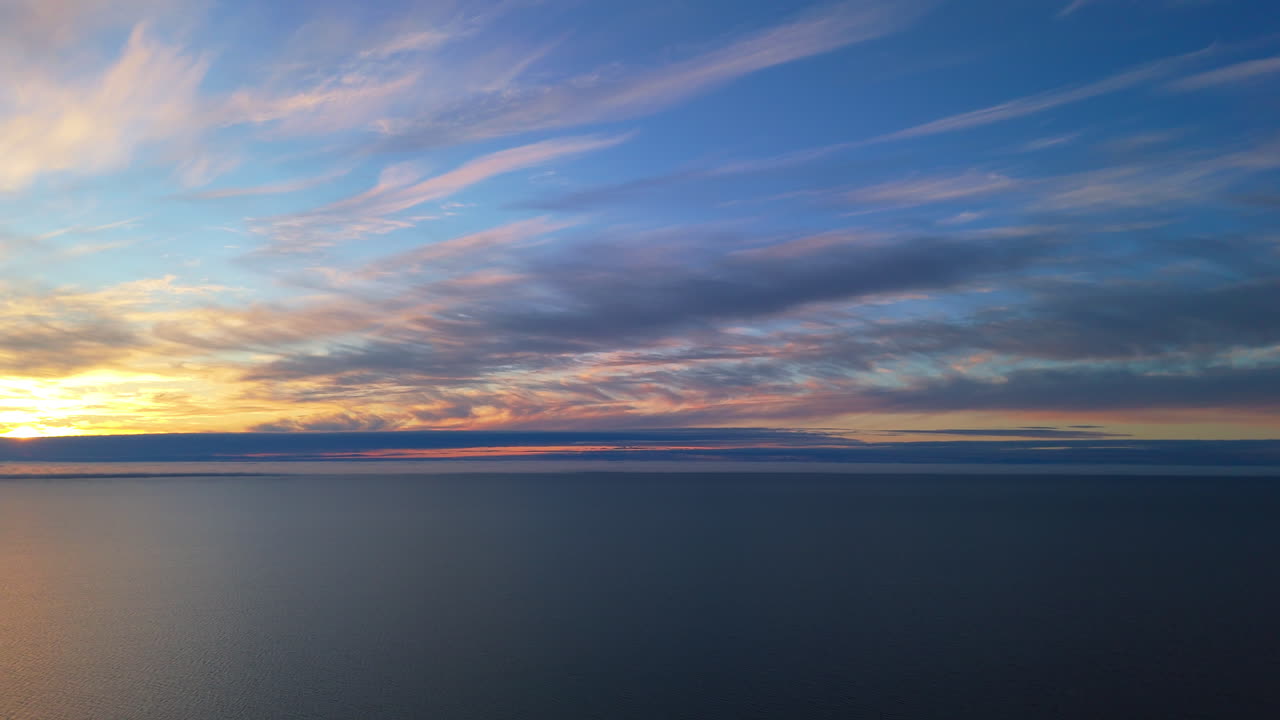 Beautiful sunset over the sea with colorful clouds