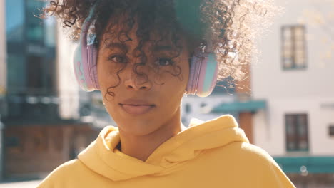 young woman listening to music outdoors