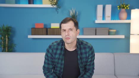adult man looking at camera with interest and attention scrutinizing.