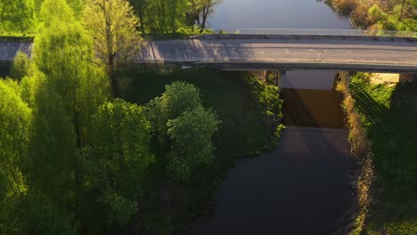 Aerial-shot-of-old-bridge-over-river-in-Northern-Europe