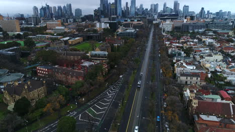 Aerial-reveal-of-University-of-Melbourne-with-tram