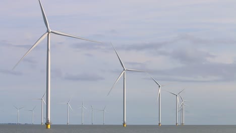 turning wind turbines at fryslan wind farm, ijsselmeer, the netherlands