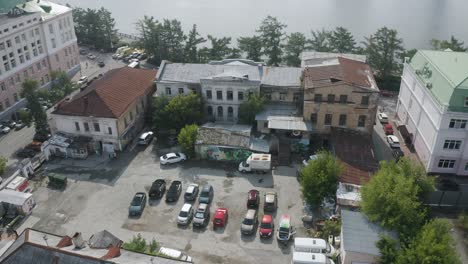 aerial view of urban area with parking lot and old buildings