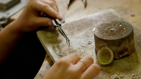 jewelry designer working in workshop 4k