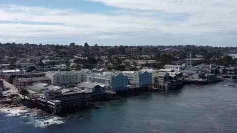 aerial close-up dolly shot of historic cannery row in monterey, california