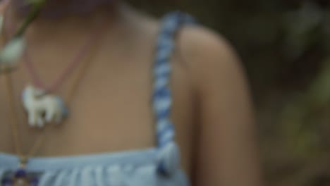 fleeting moments: unfocused glimpse of a woman and her flower