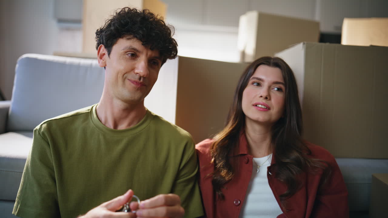 Family planning new interior sitting in living room full carton boxes closeup